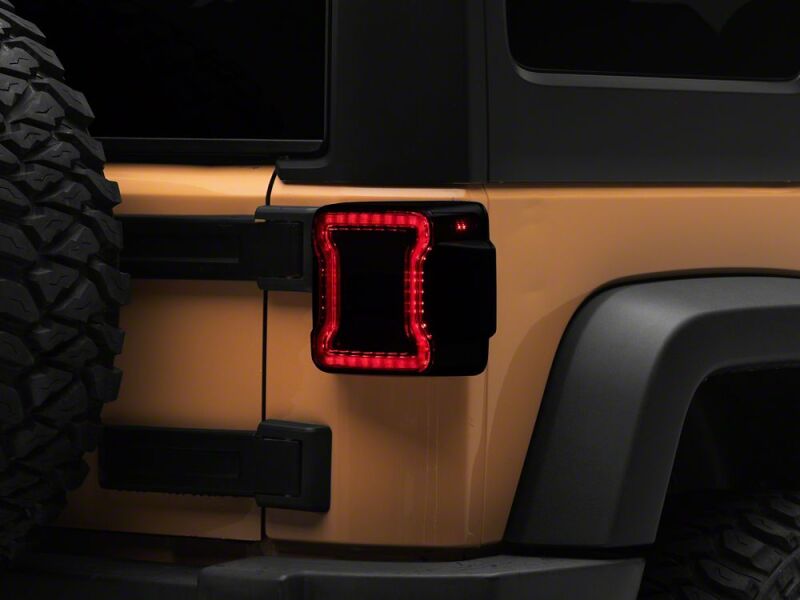 Raxiom 07-18 Jeep Wrangler JK Axial Series JL Style LED Tail Lights- Black Housing- Smoked Lens-thumbmail-1